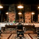 black leather barber chair near brown brick wall
