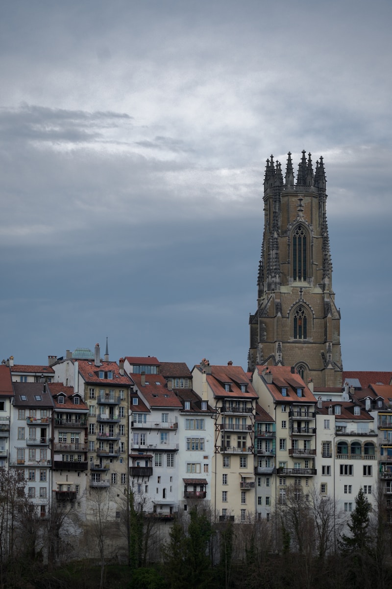 a very tall building with a clock tower in the background